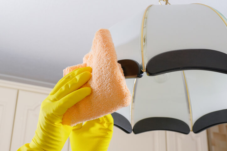 Start cleaning light fixtures by using microfiber cloth to eliminate dust