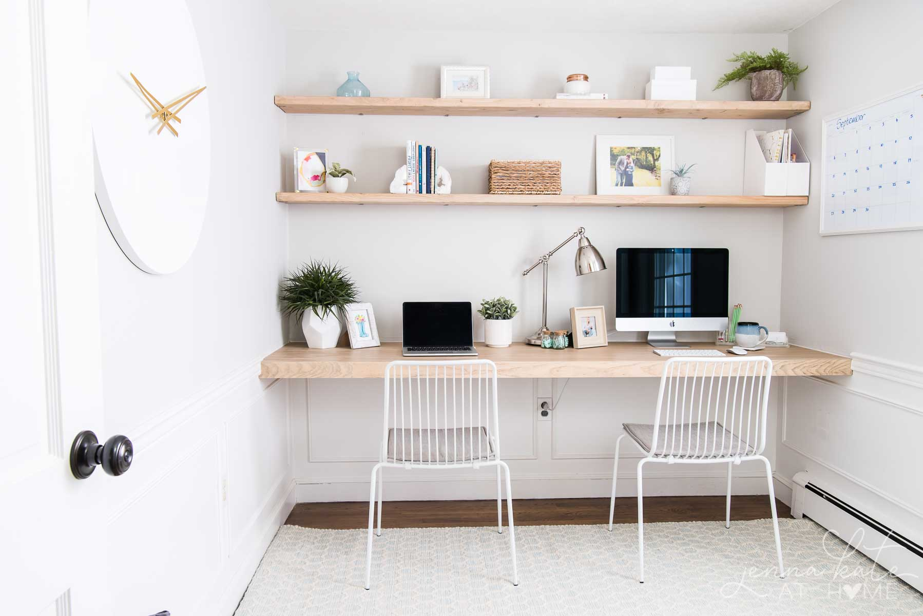 A workspace with floating shelves installed on the wall