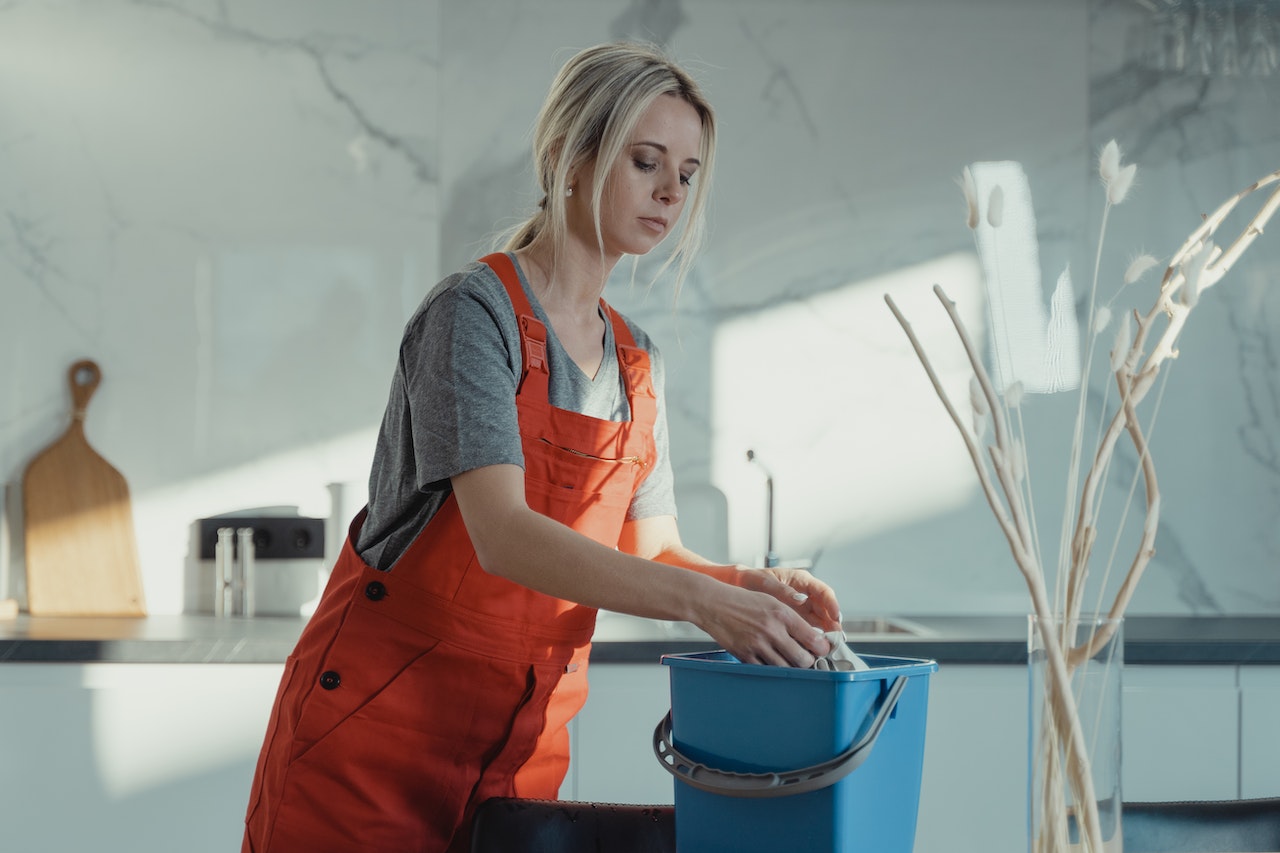 A woman cleaning her home after renovations