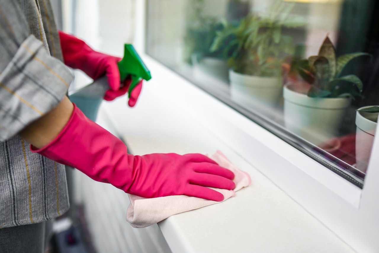 When doing post-renovation cleaning, tackle the windows like the person in the photo