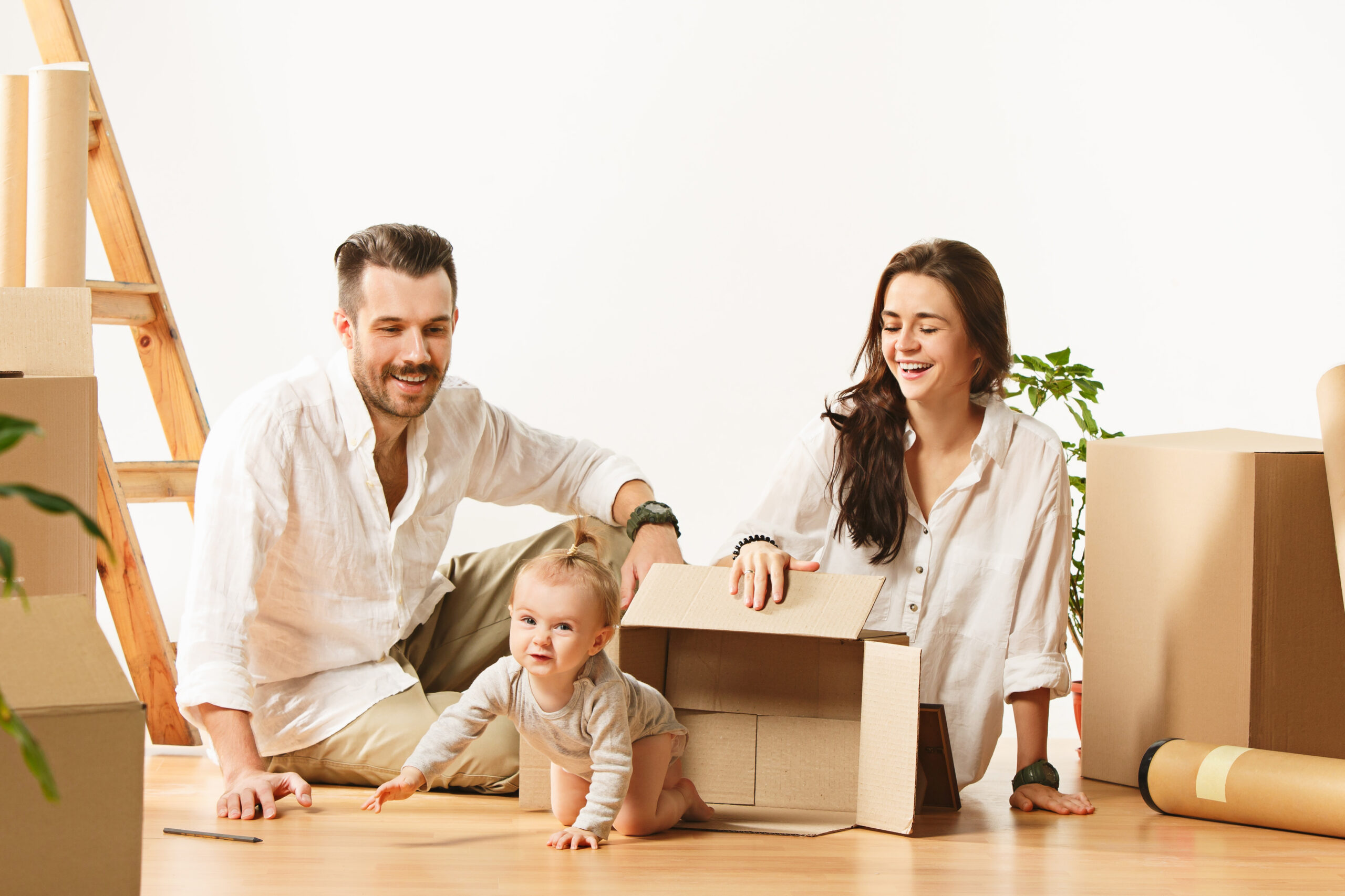 Couple moving to a new home - Happy married people buy a new apartment to start new life together